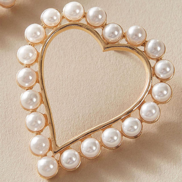 Korean fashion OL hollow heart pearl ear studs