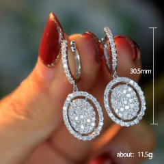 Full of rhinestone oval charm huggie earrings