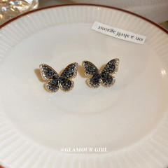 Black rhinestone setting butterfly ear studs