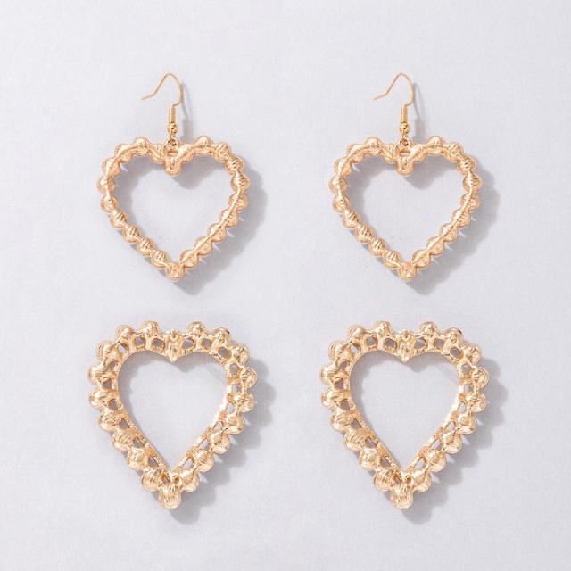 Korean fashion OL hollow heart pearl ear studs