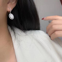 Full of rhinestone oval charm huggie earrings