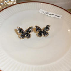 Black rhinestone setting butterfly ear studs