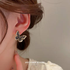 Black rhinestone setting butterfly ear studs