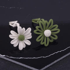 Daisy flower asymmetric clip on earrings