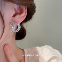 Silver needle diamond letter D ear studs