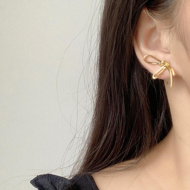 Diamond knot clip on earrings