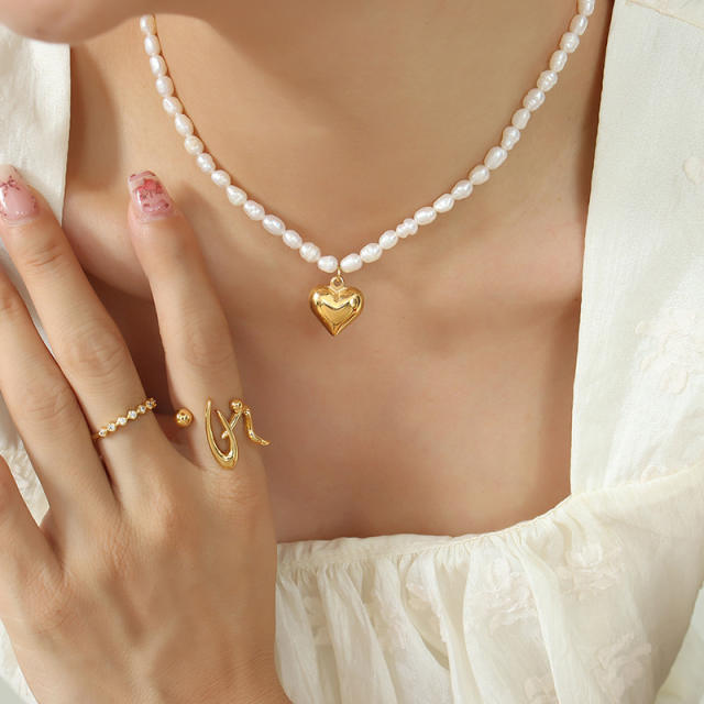 Elegant pearl bead necklace with heart charm