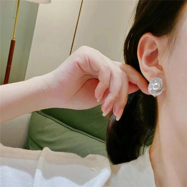 Elegant diamond shell shape pearl studs earrings