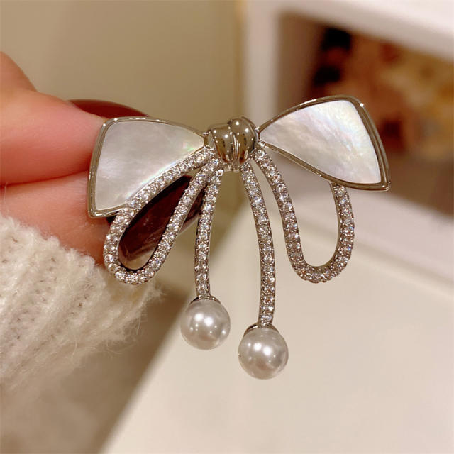 Vintage natural shell bow diamond brooch