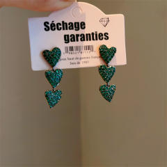 Pave setting dark green rhinestone heart earrings