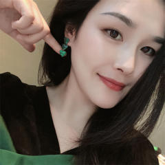 Pave setting dark green rhinestone heart earrings