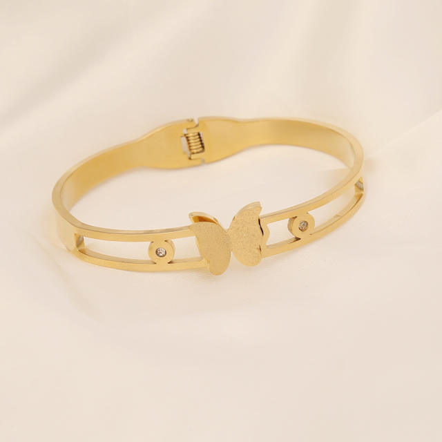 Butterfly heart symbol stainless steel bangle