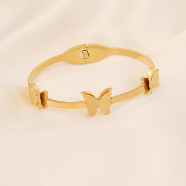 Butterfly heart symbol stainless steel bangle
