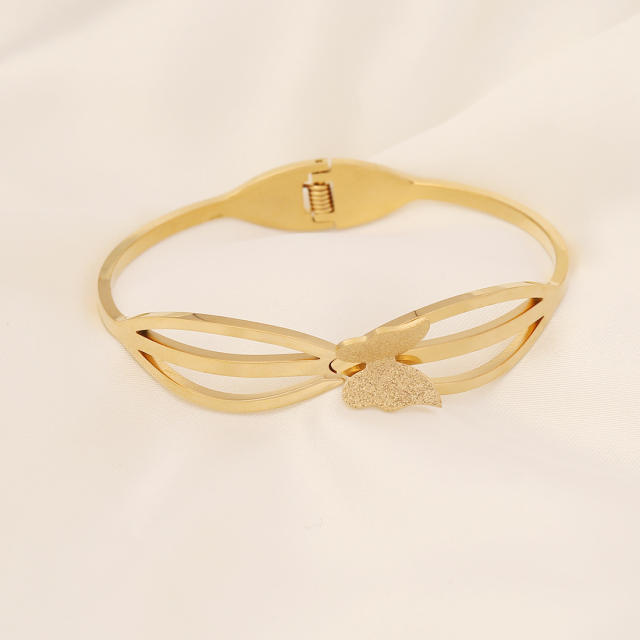Butterfly heart symbol stainless steel bangle