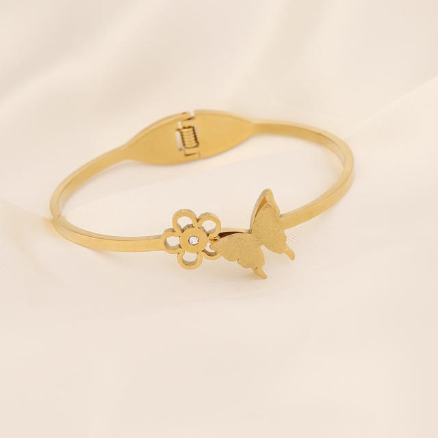 Butterfly heart symbol stainless steel bangle