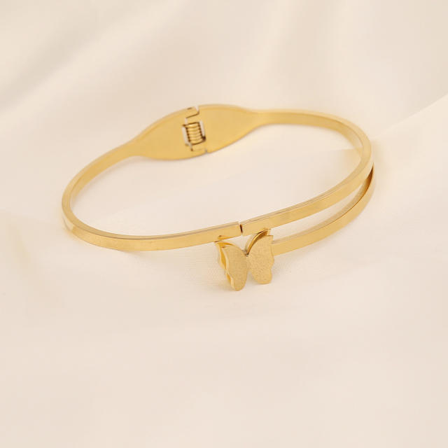 Butterfly heart symbol stainless steel bangle