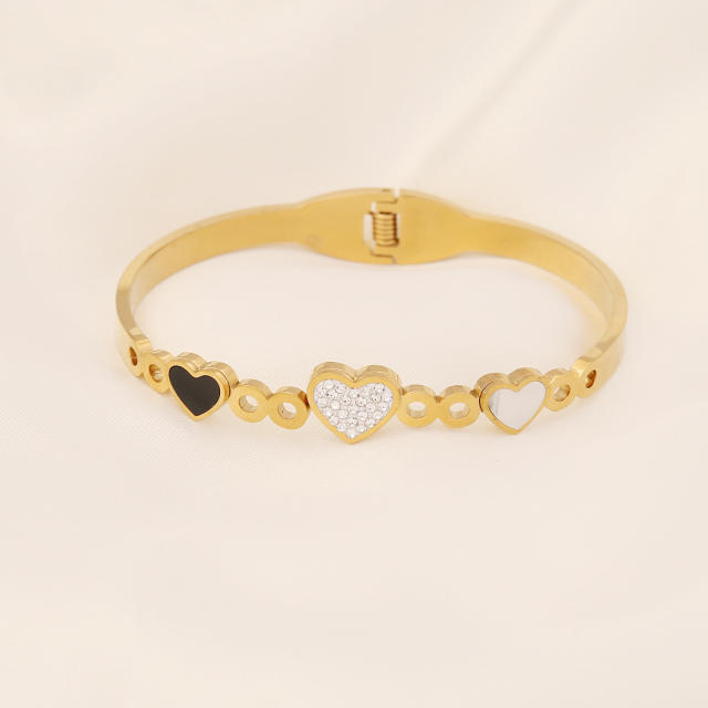 Butterfly heart symbol stainless steel bangle
