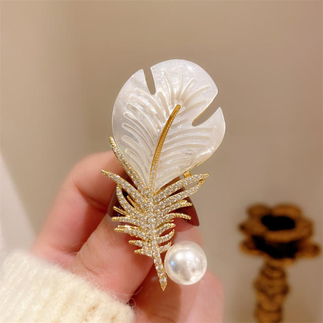 Elegant shell feather brooch