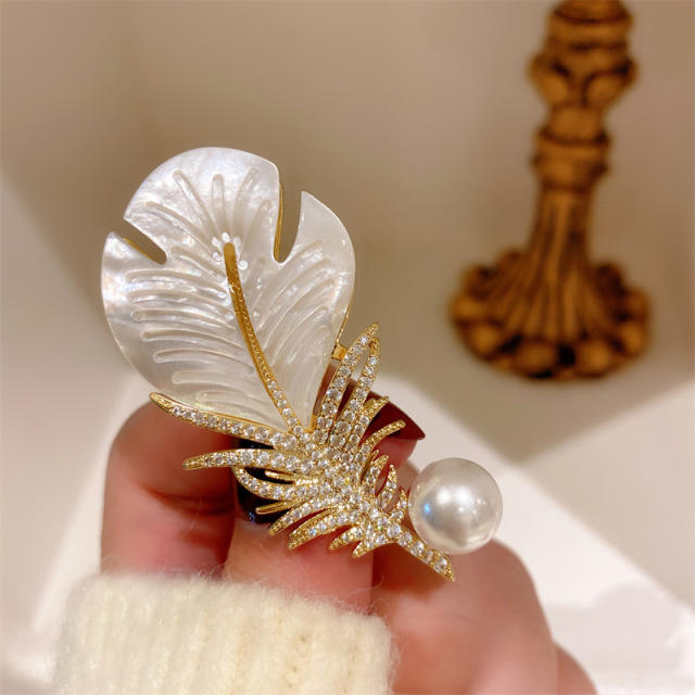 Elegant shell feather brooch