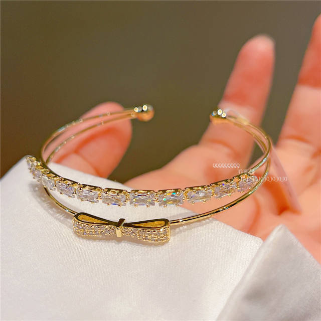 Real gold plated cubic zircon bow copper bangle