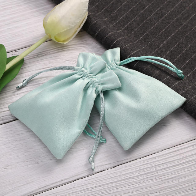 Minit green color suede jewelry bag