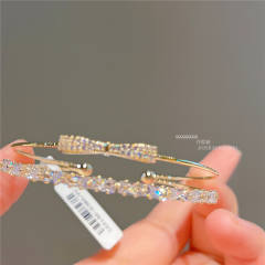 Real gold plated cubic zircon bow copper bangle