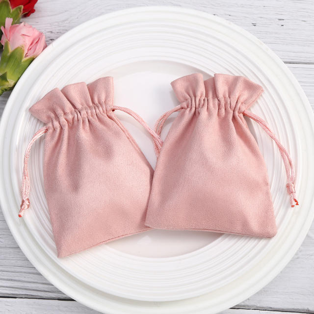 Pink color suede string jewelry bag