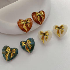 Concise gold color bow acrylic heart studs earrings