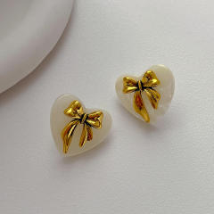 Concise gold color bow acrylic heart studs earrings