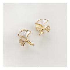 Gold plated mother shell ginkgo leaf clip on earrings
