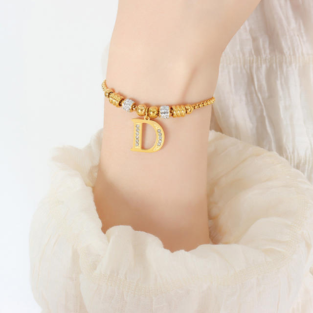 Delicate initial charm stainless steel slide bracelet