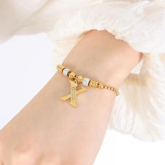 Delicate initial charm stainless steel slide bracelet