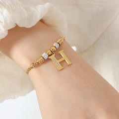 Delicate initial charm stainless steel slide bracelet