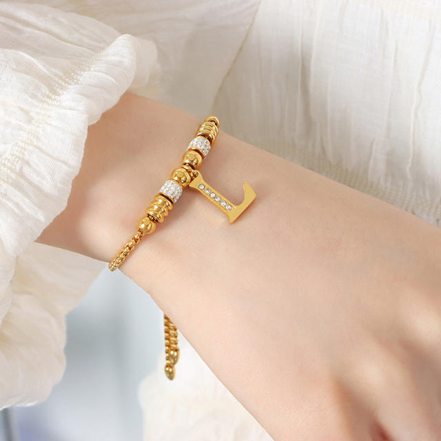 Delicate initial charm stainless steel slide bracelet