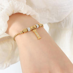 Delicate initial charm stainless steel slide bracelet
