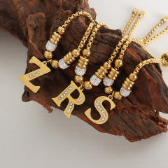 Delicate initial charm stainless steel slide bracelet
