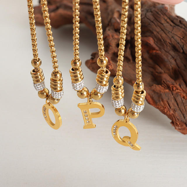 Delicate initial charm stainless steel slide bracelet