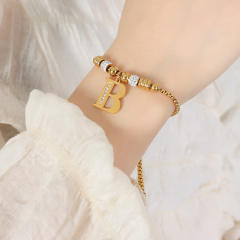 Delicate initial charm stainless steel slide bracelet