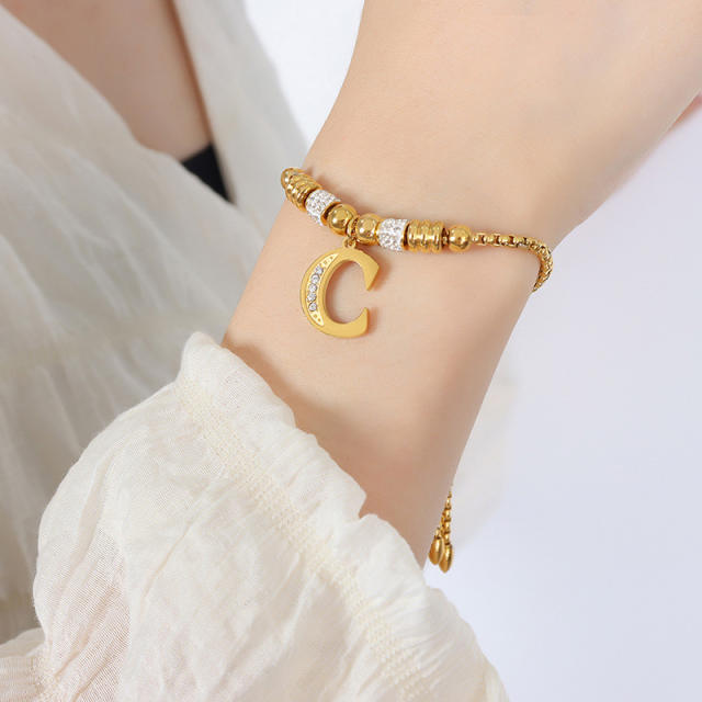 Delicate initial charm stainless steel slide bracelet