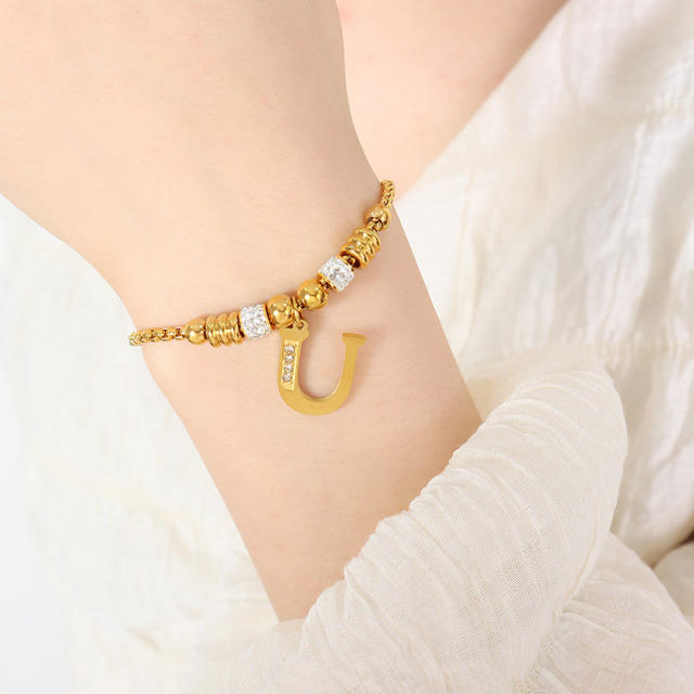 Delicate initial charm stainless steel slide bracelet