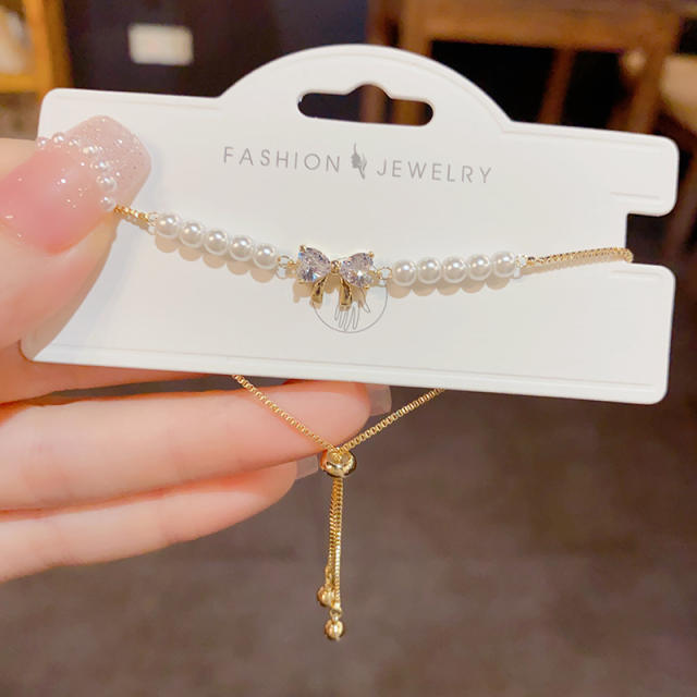 Sweet diamond bow pearl bead gold plated copper slide bracelet