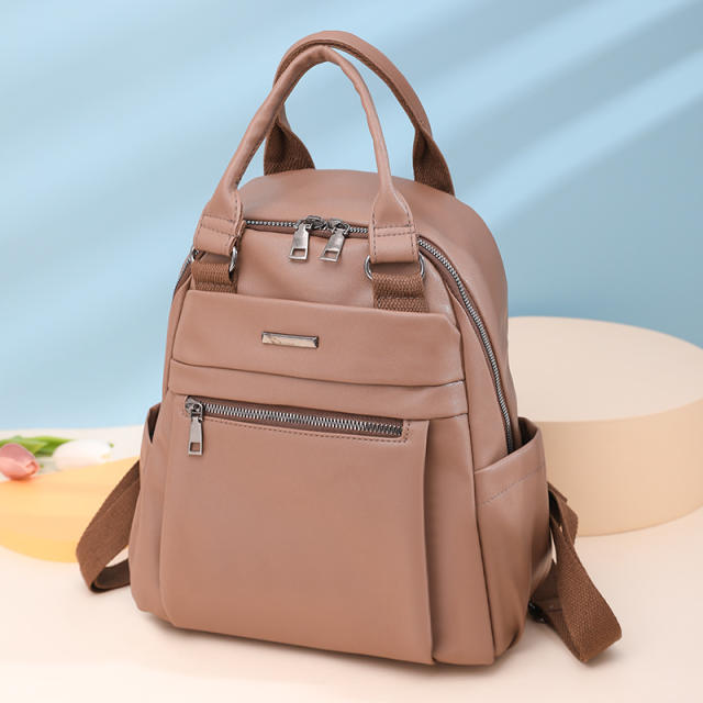 Plain color PU material soft backpack with handle