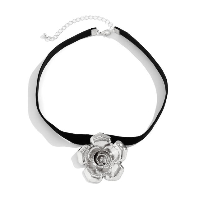 Vintage black velvet choker necklace with metal flower pendant