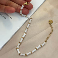 Summer white color bamboo shell stainless steel bead bracelet