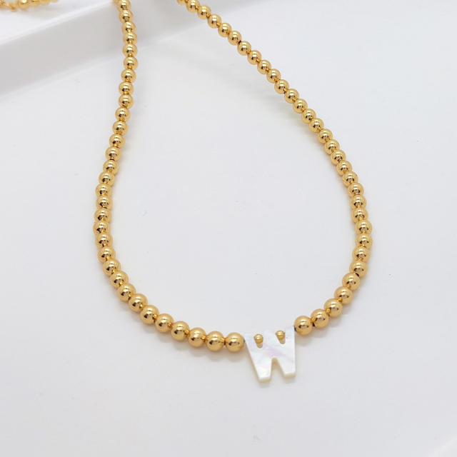 Natural shell initial letter gold plated copper beaded necklace