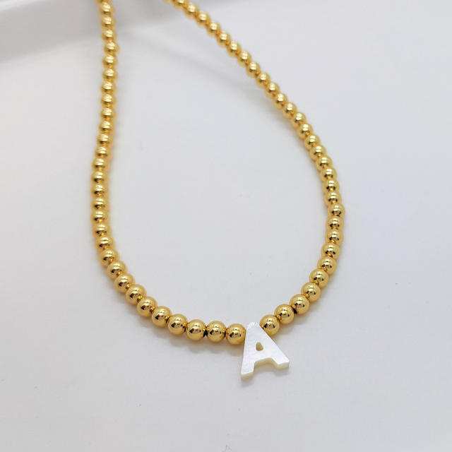 Natural shell initial letter gold plated copper beaded necklace