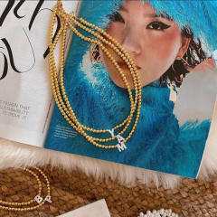 Natural shell initial letter gold plated copper beaded necklace