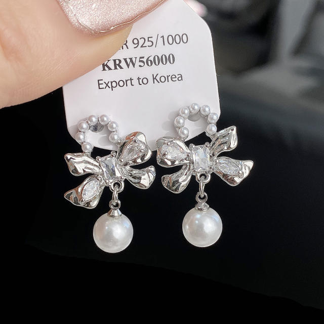 Sweet cool silver color bow pearl drop earrings