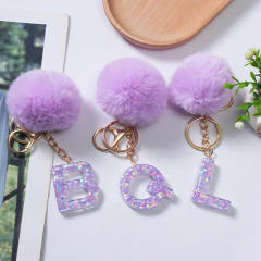 Cute purple color fluffy ball initial letter keychain