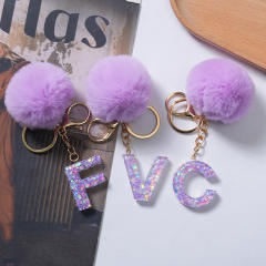 Cute purple color fluffy ball initial letter keychain